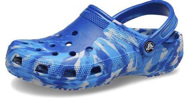 A blue tie-dye croc sandal.