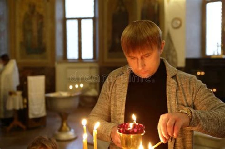 A man lights a candle