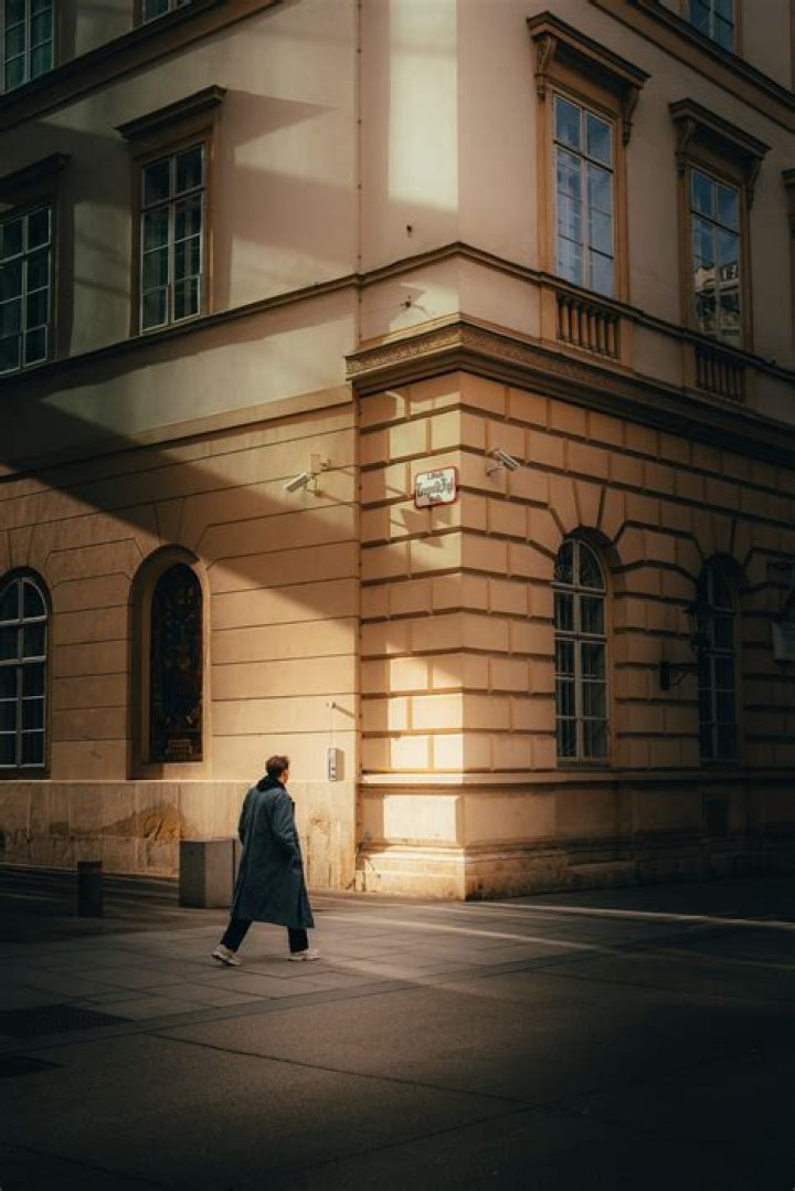 A person walks past a graffito showing late George Floyd, in Berlin, Germany, 30 May 2020. A bystander's video posted online on 25 May, appeared to show George Floyd, 46, pleading with arresting officers that he couldn't breathe as an officer knelt on his neck in Minneapolis, Minnesota. The unarmed black man later died in police custody. A series of demonstrations throughout the German capital, calling for ending of the social and economical restrictions imposed due to the coronavirus pandemic. The events are organised by groups of various motives, right wing activists, conspiracy theory believers and more, several counter demonstrations by left leaning organisations were also taking place. Anti-restrictions protests and counter demos in Berlin, Germany - 30 May 2020