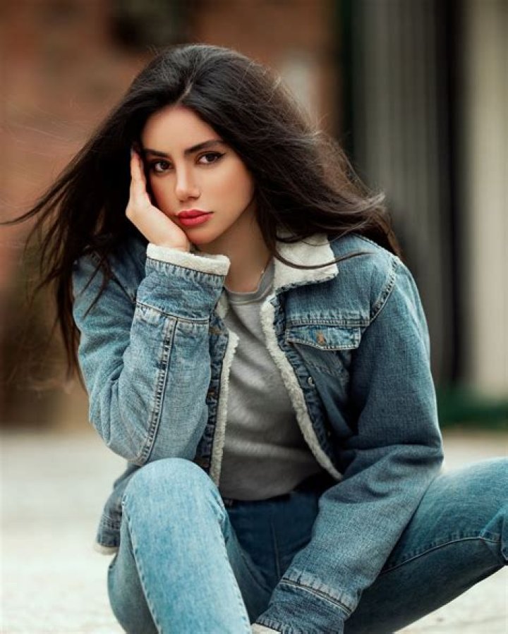 A woman wearing a denim jacket.