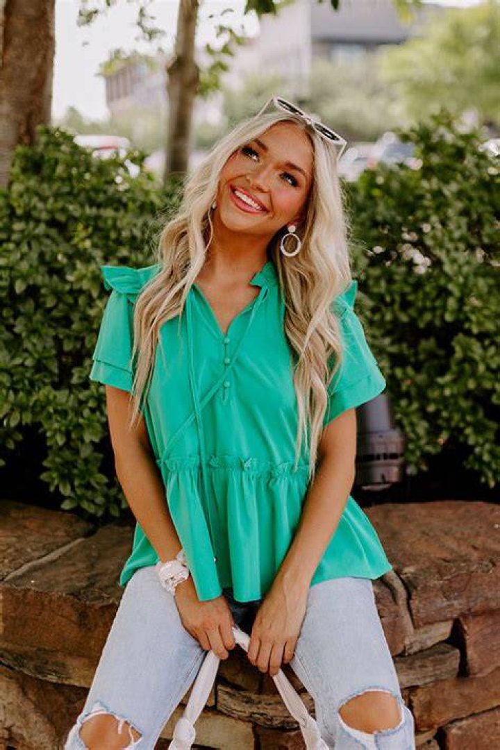 A woman wearing a mint green Verdusa dress.