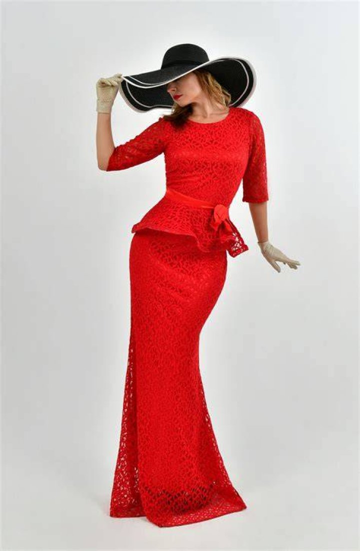 A woman wearing a red dress.