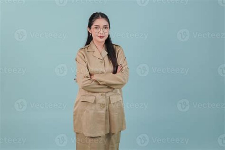 A woman wearing khaki Automet Women's Casual Shorts.
