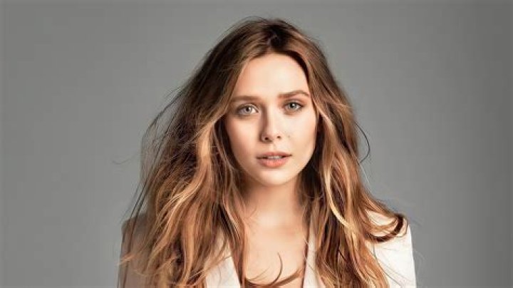 Actress Elizabeth Olsen, left, and sister designer/actress Mary-Kate Olsen attend the 2013 CFDA Fashion Awards at Alice Tully Hall on in New York 2013 CFDA Fashion Awards, New York, USA - 3 Jun 2013