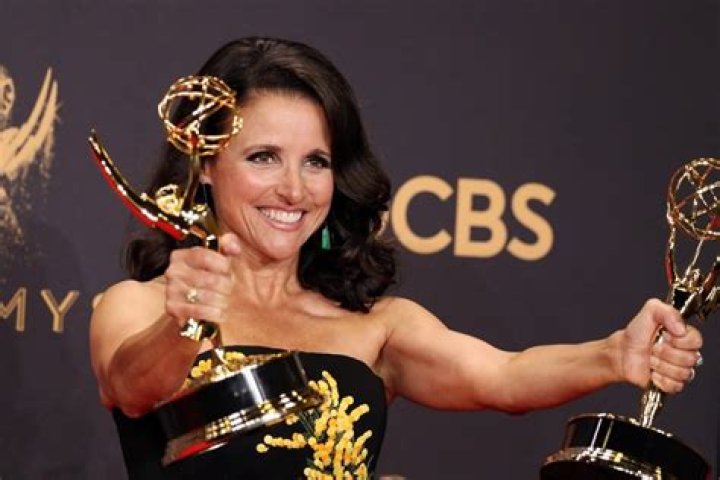 Actress Julia Louis-Dreyfus holds the Screen Actors Guild Award she won for best actress in a comedy series for her role in ?Seinfeld? during the SAG Awards, Sunday, March 8, 1998 in Los Angeles. (AP Photo/Michael J. Caulfield)