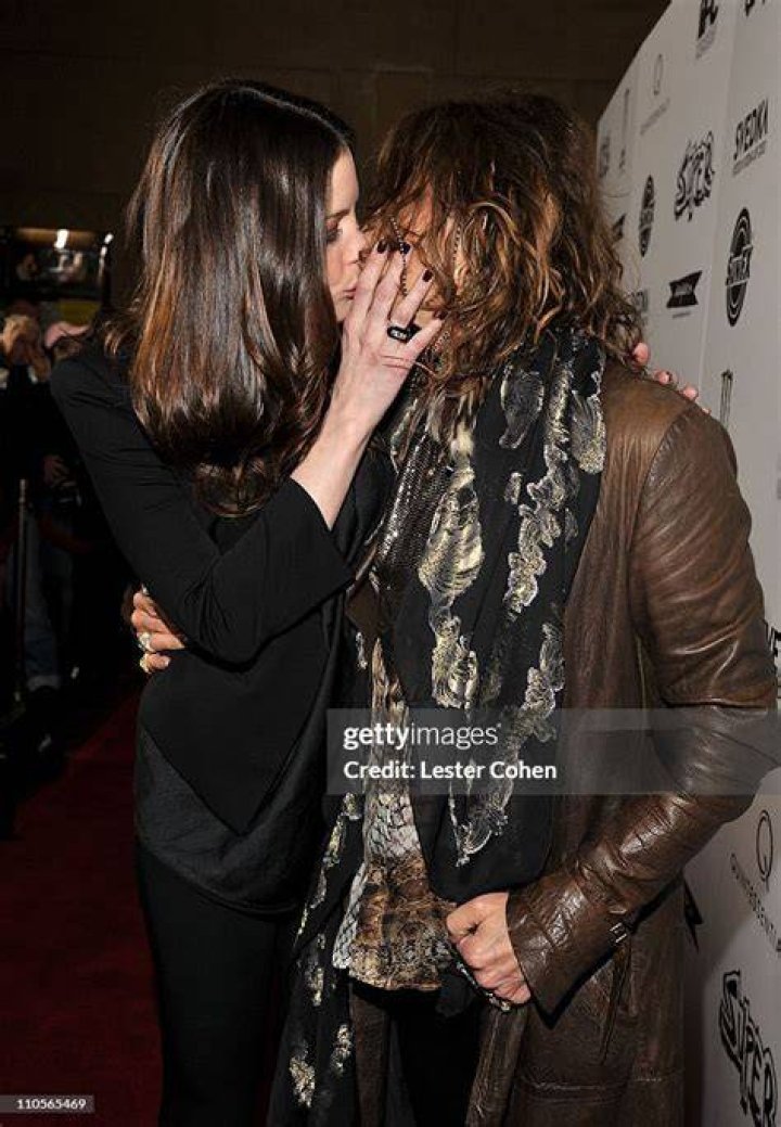 Actress Liv Tyler kisses her father, Aerosmith vocalist Steven Tyler, at the 16th Annual Rock and Roll Hall of Fame Induction Dinner Monday, March 19, 2001, in New York. (AP Photo/Kathy Willens)