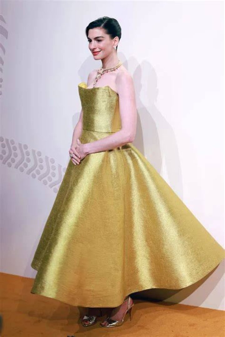 Anne Hathaway Glows In Gold