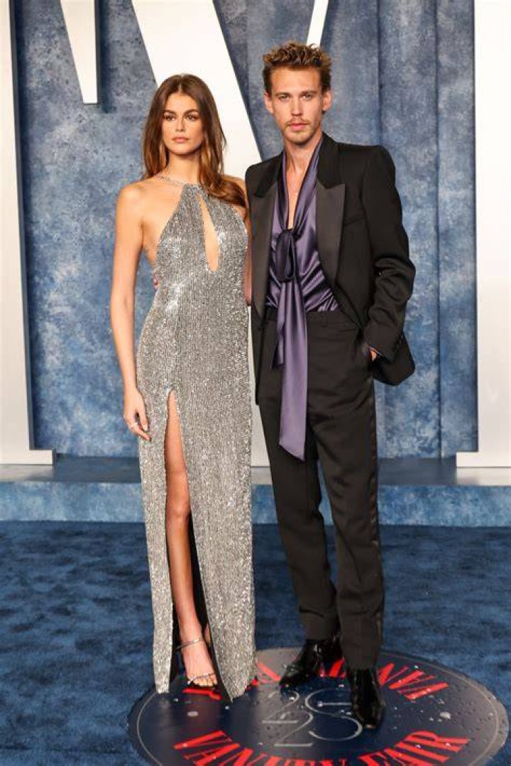 Austin Butler, left, and Kaia Gerber pose for photographers after departing the premiere of the film 'Elvis' at the 75th international film festival, Cannes, southern France 2022 Elvis Departures, Cannes, France - 25 May 2022