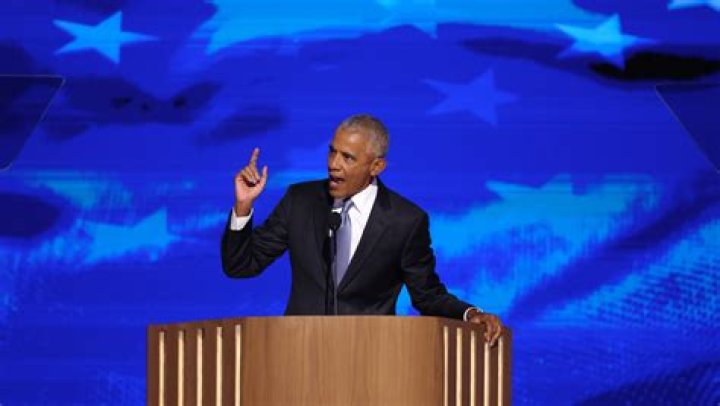 Barack Obama, District One Democratic candidate for Congress, delivers his concession speech to supporters while his wife Michelle tends to their daughter Malia during a post-primary function Tuesday, March 21, 2000, in Chicago. Incumbent Congressman Bobby Rush won the Democratic nomination. (AP Photo/Frank Polich)