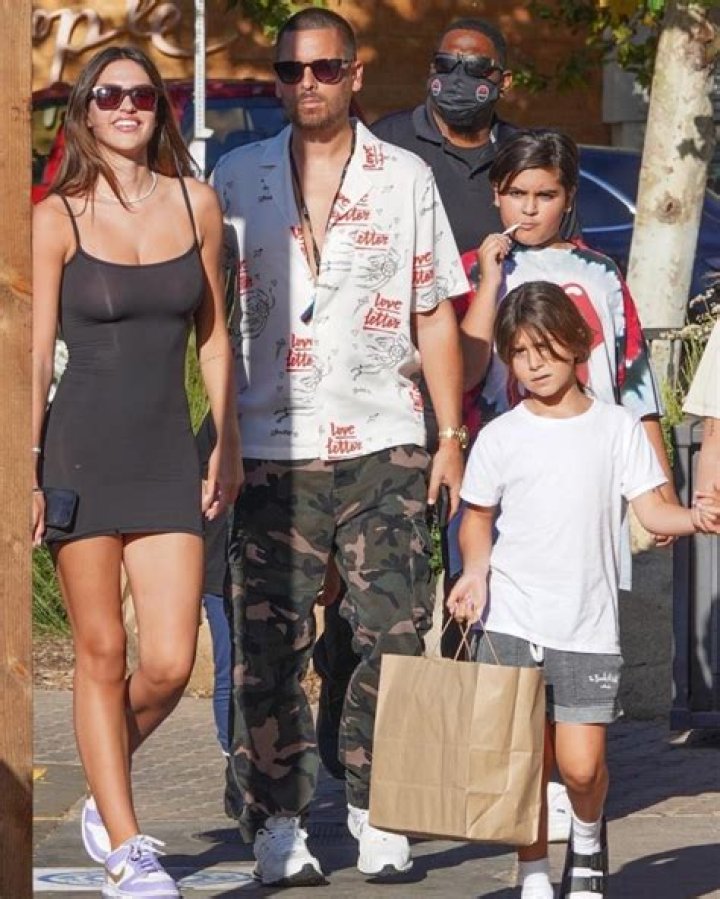 Bikini clad Amelia Hamlin happily applies sunscreen to boyfriend Scott Disick as they relax on the beach on Valentine's Day in Miami. 14 Feb 2021 Pictured: Scott Disick; Amelia Hamlin. Photo credit: MEGA TheMegaAgency.com +1 888 505 6342 (Mega Agency TagID: MEGA733444_007.jpg) [Photo via Mega Agency]