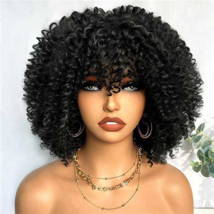 Black curly hair wig on a mannequin