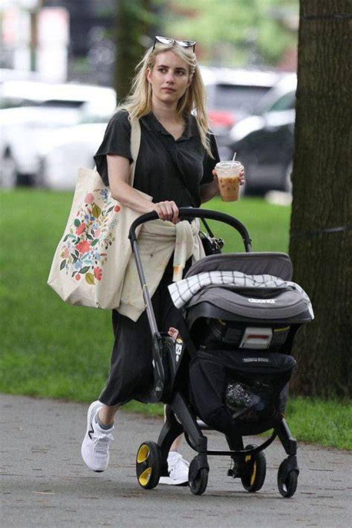 Boston, MA - *EXCLUSIVE* - Emma Roberts and Garrett Hedlund spotting kissing while out for a stroll in Boston with baby Rhodes. Their day included a visit to the Boston Public Library, sharing parenting duties by carrying Rhode's stroller down the stairs.Pictured: Emma Roberts, Garrett HedlundBACKGRID USA 25 JUNE 2021 BYLINE MUST READ: Patriot Pics / BACKGRIDUSA: +1 310 798 9111 / : +44 208 344 2007 / *UK Clients - Pictures Containing ChildrenPlease Pixelate Face Prior To Publication*
