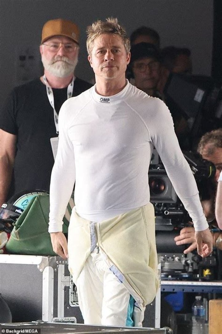 Brad Pitt shows off a surfer look