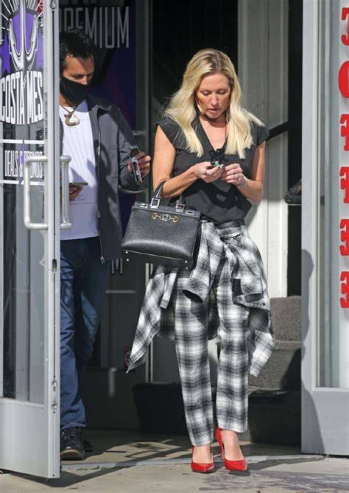 Braunwyn Windham-Burke wears a floral patterned bikin