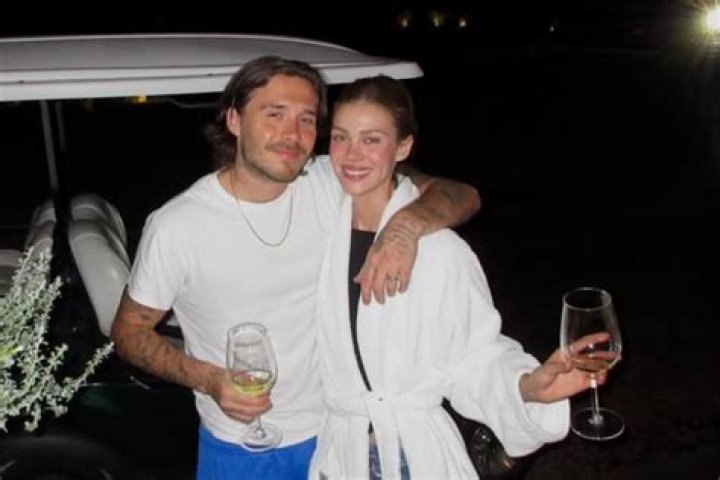 Brooklyn Beckham and Nicola Peltz share their first kiss as man and wife at their wedding in Palm Beach. 09 Apr 2022 Pictured: kiss. Photo credit: Backgrid/MEGA TheMegaAgency.com +1 888 505 6342 (Mega Agency TagID: MEGA846278_007.jpg) [Photo via Mega Agency]