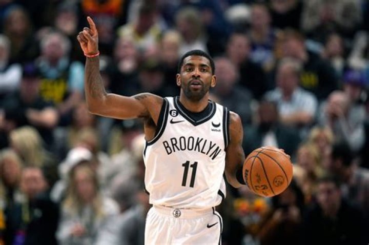 Brooklyn Nets guard Kyrie Irving (11) listens during a time out in the second half of an NBA basketball game against the Washington Wizards, Saturday, Feb. 1, 2020, in Washington. The Wizards won 113-107. (AP Photo/Nick Wass)