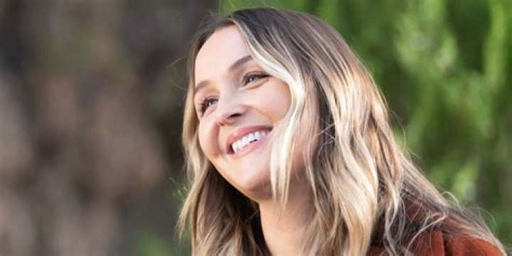 Camilla Luddington smiling on the red carpet