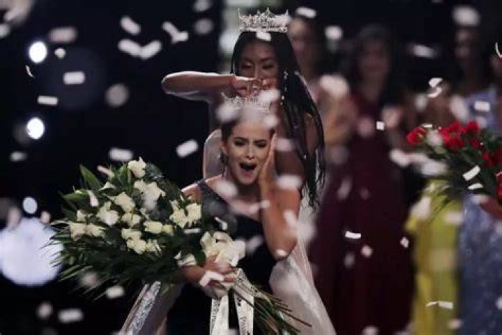 Camille Schrier, of Virginia, reacts reacts as she is crowned after winning the Miss America competition at the Mohegan Sun casino in Uncasville, Conn.,. At rear is 2019 Miss. America Nia Franklin Miss America, Uncasville, USA - 19 Dec 2019