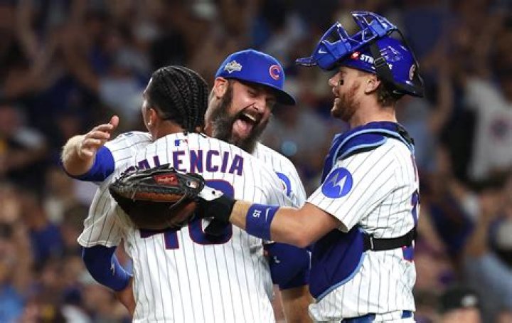 Chicago Cubs' Ben Zobrist walks through the dugout after scoring on an RBI single by Jason Heyward off Cincinnati Reds starting pitcher Asher Wojciechowski in the first inning of a baseball game, in CincinnatiCubs Reds Baseball, Cincinnati, USA - 23 Aug 2017