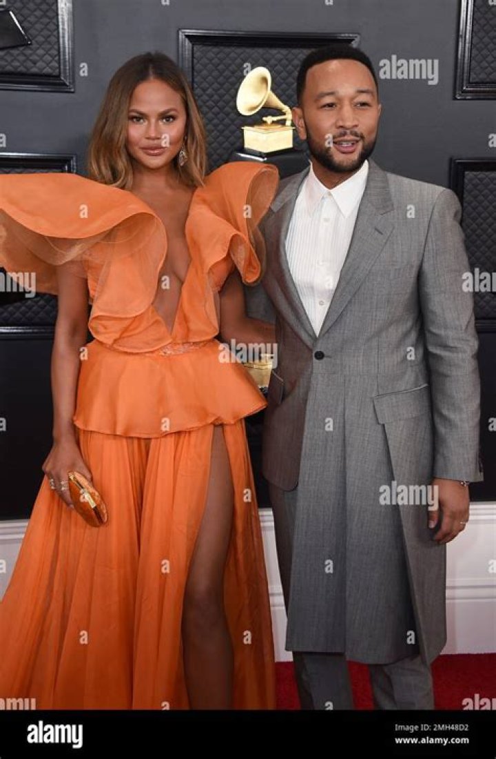 Chrissy Teigen, left, and John Legend arrive for the State Dinner with President Joe Biden and French President Emmanuel Macron at the White House in Washington France, Washington, United States - 01 Dec 2022