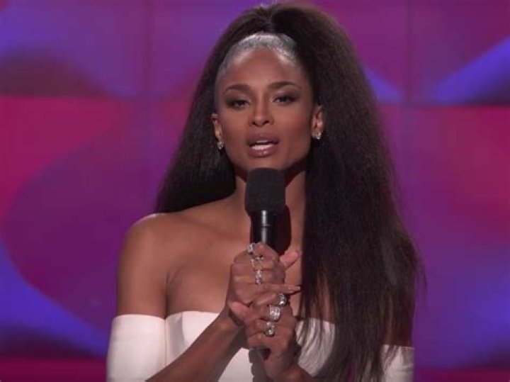 Ciara gives a speech at the White House with her son Win behind her