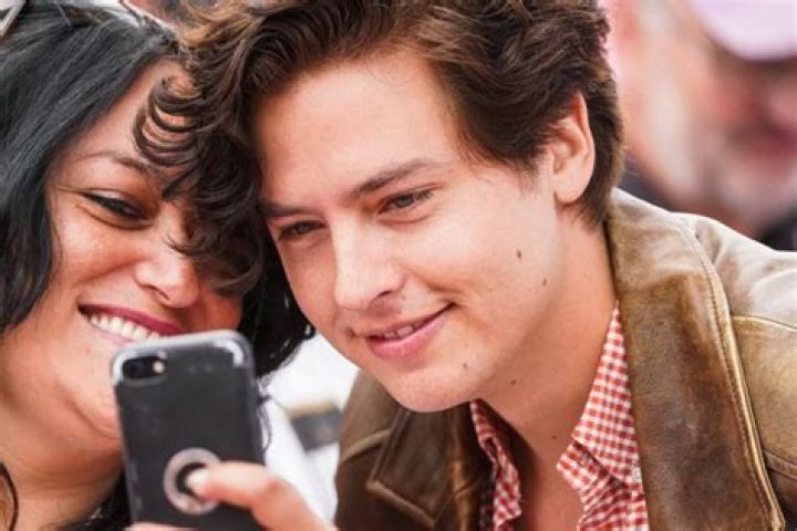 Cole Sprouse walks
