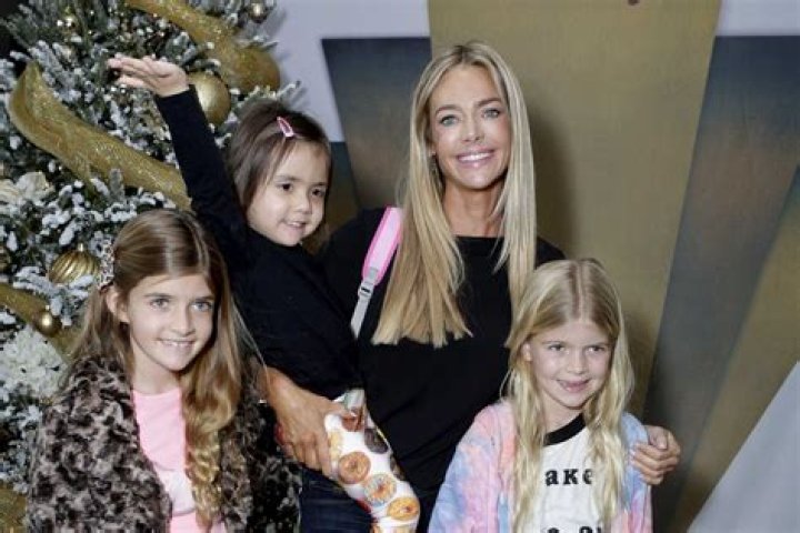 Denise Richards and daughters Sam and Lola go for a swim in the crystal blue ocean in the Bahamas. Denise was wearing a tiny blue bikini and had a blast playing with her girls at the waters' edge. Pix taken April 2. Pictured: Ref: SPL263820 030411 NON-EXCLUSIVE Picture by: SplashNews.com Splash News and Pictures Los Angeles: 310-821-2666 New York: 212-619-2666 London: 0207 644 7656 Milan: 02 4399 8577 World Rights