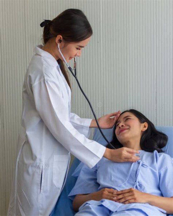 Doctor checking patient's skin