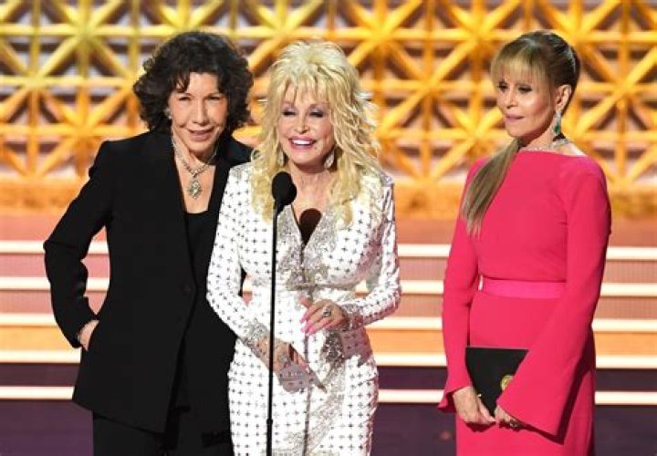 Dolly Parton, left, and Kelly Clarkson embrace onstage at the 57th Academy of Country Music Awards, at Allegiant Stadium in Las Vegas 57th ACM Awards - Show, Las Vegas, United States - 07 Mar 2022