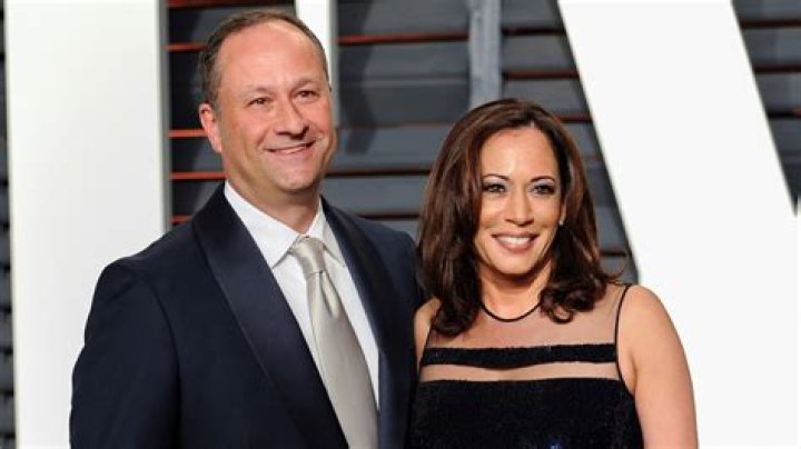 Douglas Emhoff, left, husband of U.S. Sen. Kamala Harris, D-California, and children Ella and Cole, stand on stage after Harris launched her presidential campaign at a rally in her hometown of Oakland, Calif., Sunday, Jan. 27, 2019. (AP Photo/Tony Avelar)