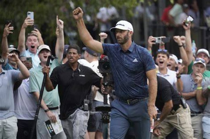 Dustin Johnson celebrates with his partner Paulina Gretzky on the 18th green after winning the Tour Championship golf tournament and FedEx Cup on at East Lake Golf Club in Atlanta Tour Championship Golf, Atlanta, United States - 07 Sep 2020