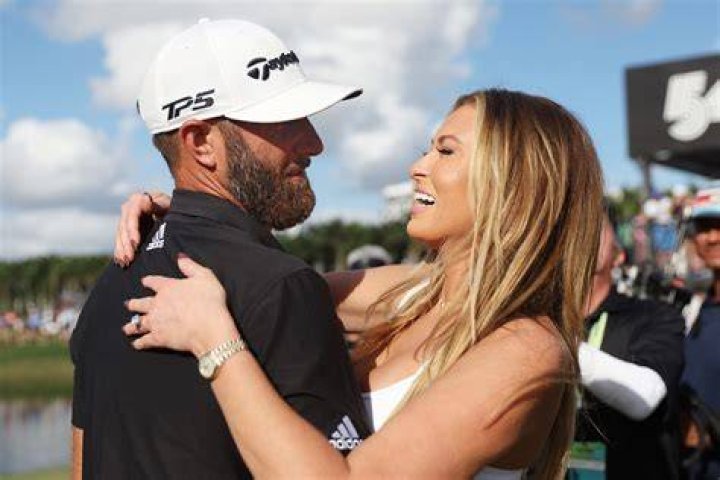 Dustin Johnson kisses Paulina Gretzky when holds the Championship Trophy on the 18th green after winning his first major championship in the final round at the U.S. Open at Oakmont Country Club near Pittsburgh, Pennsylvania on June 19, 2016. Johnson won with a score of 5 under par. U.s. Open Golf 2016, Oakmont, Pennsylvania, United States - 19 Jun 2016
