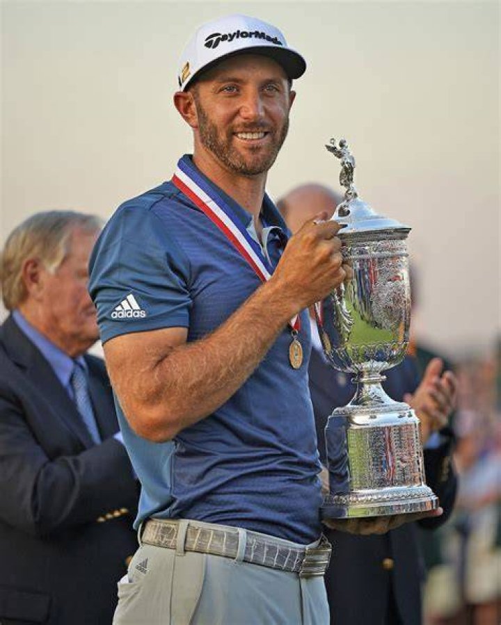 Dustin Johnson of the US, left, walks with his partner Paulina Gretzky on 16th green at the end of a fourball match on the opening day of the 42nd Ryder Cup at Le Golf National in Saint-Quentin-en-Yvelines, outside Paris, France, . Johnson and Fowler won 4 and 2 over Europe's Rory McIlroy and Thorbjorn Olesen Ryder Cup Golf, Saint-Quentin-en-Yvelines, France - 28 Sep 2018