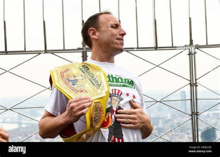 Eleven-time and defending men's champion Joey Chestnut poses on the 86th floor observation deck during the Nathan's Famous international Fourth of July hot dog eating contest weigh-in at the Empire State Building, in New York 2019 Nathan's Hot Dog Eating Contest Weigh-In, New York, USA - 03 Jul 2019