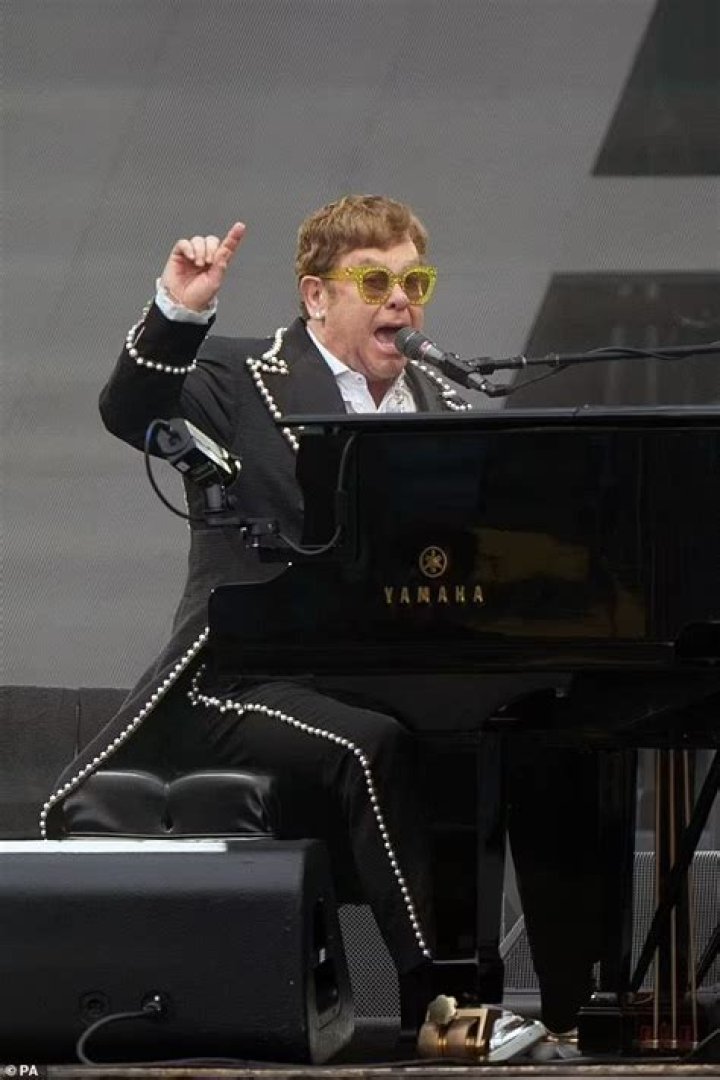 Elton John Wows In White