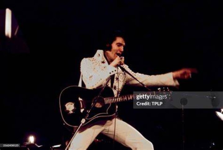 Elvis Presley performs on stage in an unspecified location. A three-CD box set slated for release the first week of August 2013 chronicles two recording sessions by Elvis Presley at the renowned Stax Records in Memphis in 1973 Elvis Presley at Stax, USA