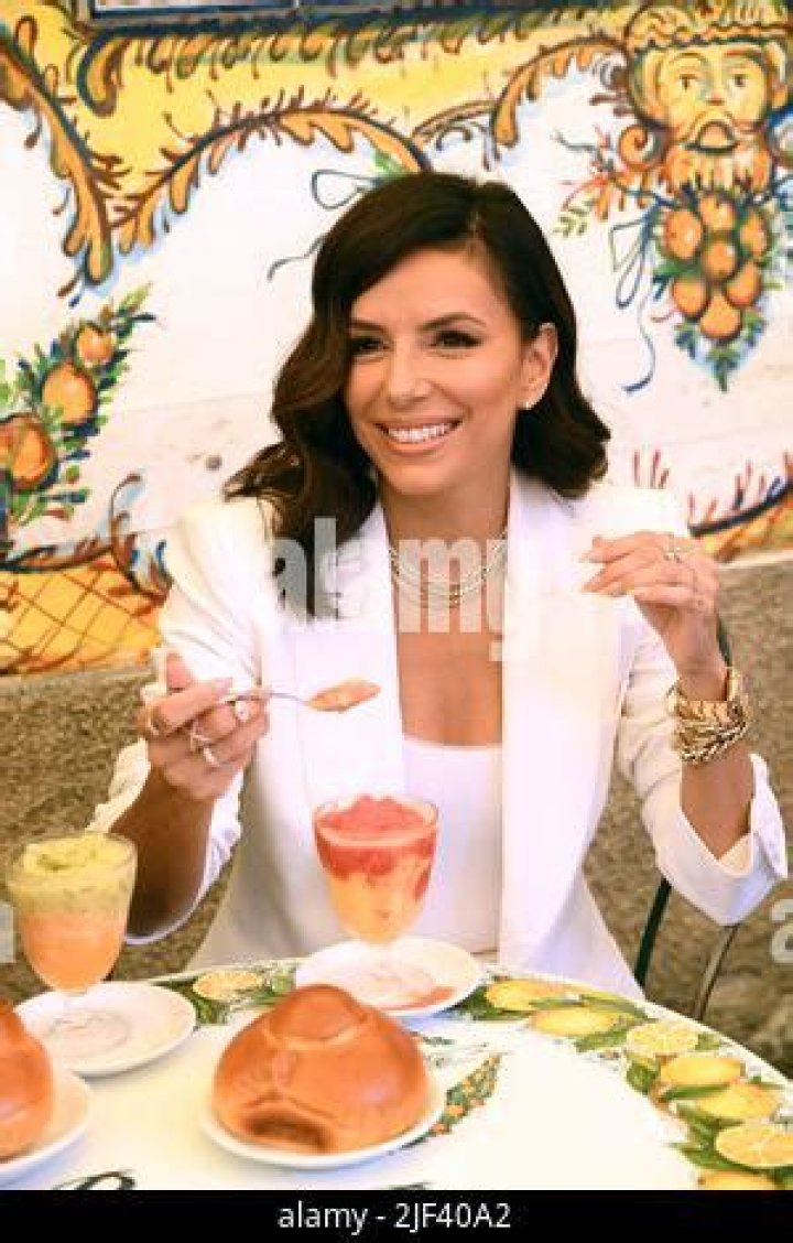 Eva Longoria eats a granita at the Bam Bar in the company of Andrea Iervolino in Taormina, Italy. Pictured: Eva Longoria Ref: SPL5322761 290622 NON-EXCLUSIVE Picture by: Maurizio D'Avanzo/IPA / SplashNews.com Splash News and Pictures USA: +1 310-525-5808 London: +44 (0)20 8126 1009 Berlin: +49 175 3764 166 World Rights, No France Rights, No Italy Rights, No Portugal Rights, No Spain Rights