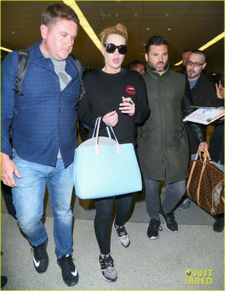 EXCLUSIVE: Iggy Azalea was spotted out in Beverly Hills on Wednesday evening, as she made a stop for Frozen Greek Yogurt . The stylish rapper wore a Vivienne Westwood Corset, and Jacket along with a Bold Christian Dior Statement necklace . She wore a black face mask to stay safe , and carried a Dior Saddle bag , to complete her stylish look. She took to instagram today to deny any involvement in a lawsuit directed at French Montana's Brother, who hit a man with a car that belonged to Azalea. 22 Jul 2020 Pictured: Iggy Azalea. Photo credit: MEGA TheMegaAgency.com +1 888 505 6342 (Mega Agency TagID: MEGA690320_001.jpg) [Photo via Mega Agency]