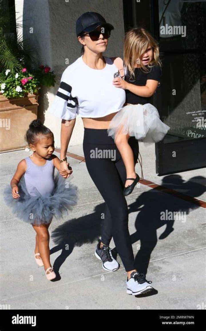 *EXCLUSIVE* Los Angeles, CA - Kourtney Kardashian and Travis Barker have dinner with Mason at Katsu-ya in Los Angeles, CA. Kourtney was wearing pajamas and a Blink 182 band t-shirt. Shot on 02/07/22. Pictured: Kourtney Kardashian, Travis Barker BACKGRID USA 8 FEBRUARY 2022 USA: +1 310 798 9111 / UK: +44 208 344 2007 / *UK Clients - Pictures Containing Children Please Pixelate Face Prior To Publication*