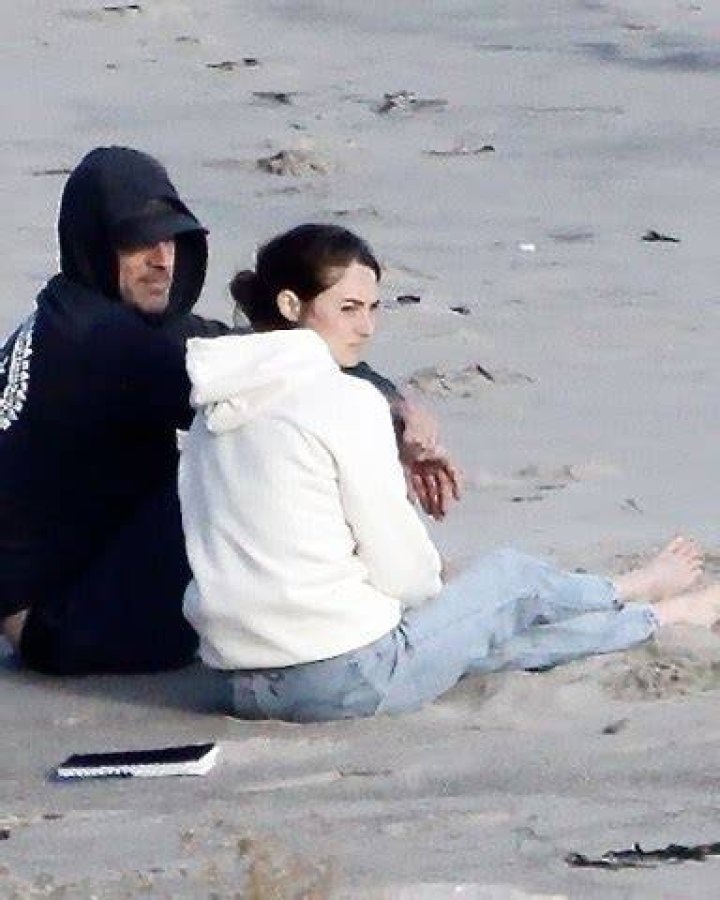 *EXCLUSIVE* Malibu, CA - Actress Shailene Woodley and her football star fiancee Aaron Rodgers cuddle together with their dog as they take in the lovely Malibu sunset. The couple recently announced they are engaged and Shailene was spotted wearing the sparkler. Shailene had a notebook that she read from and they both took turns tossing the German Shepherd a tennis ball to fetch. Pictured: Shailnee Woodley, Aaron Rodgers BACKGRID USA 8 APRIL 2021 BYLINE MUST READ: BACKGRID USA: +1 310 798 9111 / UK: +44 208 344 2007 / *UK Clients - Pictures Containing Children Please Pixelate Face Prior To Publication*