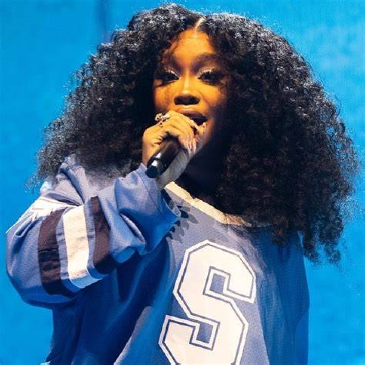 EXCLUSIVE: Singer SZA is all smiles at the beach in Hawaii as she celebrates chart-topping success with her new album 'SOS'. The 33-year-old hitmaker - real name Solana Imani Rowe - looked happy and relaxed as she hit the beach with her producer ThankGod4Cody, who is credited on seven songs on the history-making R&B album. She rocked a plunging pink halter neck swimsuit and matching sarong, also revealing a nip slip as she cooled off with a dip in the ocean. The New Jersey-raised R&B singer-songwriter is currently holding the top spot on the Billboard 200 with her long-awaited second LP. She recently took to Instagram, telling fans: "3 weeks at number one fully minding my business n not giving a f**k . Thank God." In her latest lyrics, the 'Hit Different' songstress has seemingly addressed plastic surgery rumors, responding to rampant speculation around whether her body has been cosmetically enhanced. 03 Jan 2023 Pictured: SZA. Photo credit: MEGA TheMegaAgency.com +1 888 505 6342 (Mega Agency TagID: MEGA929982_021.jpg) [Photo via Mega Agency]