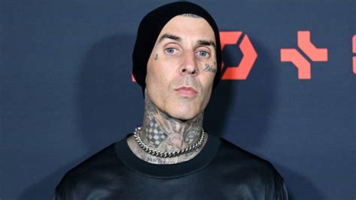 EXCLUSIVE: Travis Barker Looked Cool In White Showing Off His Toned Arms While Out With Son Landon In Calabasas, CA. The Father & Son Duo Were Spotted Leaving Travis's Recording Studio After Hours Of Recording For His Son's New Album. The Rocker Was Also Seen Getting A Special Delivery From One Of Kourtney's Assistants. 11 Jul 2022 Pictured: Travis Barker Looked Cool In White Showing Off His Toned Arms While Out With Son Landon In Calabasas, CA. The Father & Son Duo Were Spotted Leaving Travis's Recording Studio After Hours Of Recording For His Son's New Album. The Rocker Was Also Seen Getting A Special Delivery From One Of Kourtney's Assistants. Photo credit: @CelebCandidly / MEGA TheMegaAgency.com +1 888 505 6342 (Mega Agency TagID: MEGA877209_004.jpg) [Photo via Mega Agency]