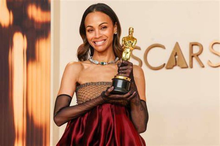 EXCLUSIVE: Zoe Saldana and her husband Marco Perego Saldana enjoy a fun day at Disneyland. The happy couple were seen having a fun day with their kids taking pictures, eating snacks and riding many of the park's rides including the Radiator Springs racers and the Little mermaid ride. Zoe was seen posing and being super about taking pictures with her friends **SPECIAL INSTRUCTIONS*** Please pixelate children's faces before publication.***. 02 Apr 2022 Pictured: Zoe Saldana and Marco Perego. Photo credit: Snorlax / MEGA TheMegaAgency.com +1 888 505 6342 (Mega Agency TagID: MEGA844234_029.jpg) [Photo via Mega Agency]