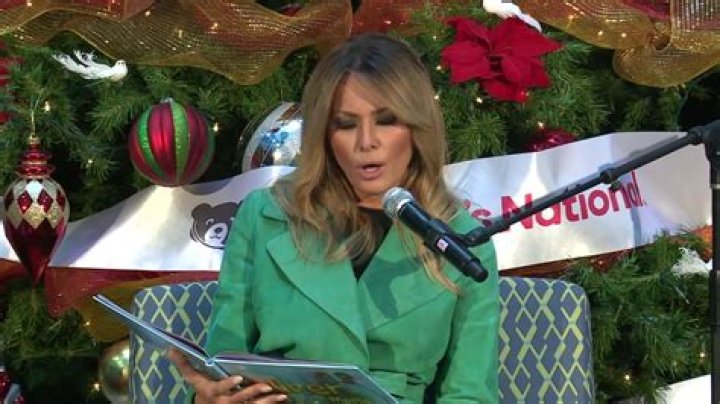 First lady Melania Trump reads a Christmas book titled, "Oliver the Ornament Meets Marley and Joan and Abbey," at Children's National Hospital, Tuesday, Dec. 15, 2020, in Washington. Due to pandemic concerns there were two children in the room and the reading was broadcast to children in the rest of the hospital. (AP Photo/Jacquelyn Martin)