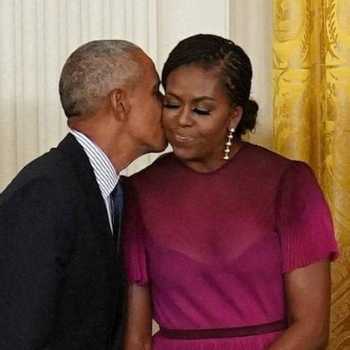 Former President Barack Obama kisses his wife former first lady Michelle Obama after they unveiled their official White House portraits during a ceremony for the unveiling in the East Room of the White House, in Washington Biden Obama Portraits, Washington, United States - 07 Sep 2022