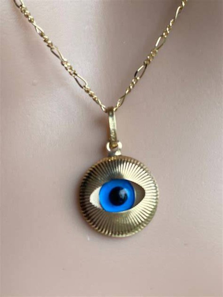 Fossil Evil Eye Pendant Gold-tone Stainless Steel Necklace, $48, Fossil.com
