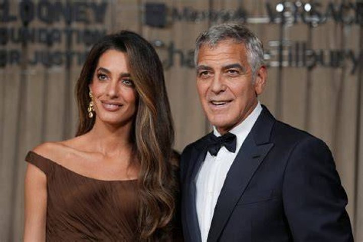 George Clooney and his wife, Amal arrive for the formal Artist's Dinner honoring the recipients of the 45th Annual Kennedy Center Honors at the Department of State in Washington, D.C. on Saturday, December 3, 2022. The 2022 honorees are: actor and filmmaker George Clooney; contemporary Christian and pop singer-songwriter Amy Grant; legendary singer of soul, Gospel, R&B, and pop Gladys Knight; Cuban-born American composer, conductor, and educator Tania Le&radic;&ge;n; and iconic Irish rock band U2, comprised of band members Bono, The Edge, Adam Clayton, and Larry Mullen Jr. Credit: Ron Sachs / Pool via CNP Pictured: George Clooney,Amal Clooney Ref: SPL5507657 031222 NON-EXCLUSIVE Picture by: Ron Sachs/CNP / SplashNews.com Splash News and Pictures USA: +1 310-525-5808 London: +44 (0)20 8126 1009 Berlin: +49 175 3764 166 World Rights, No France Rights
