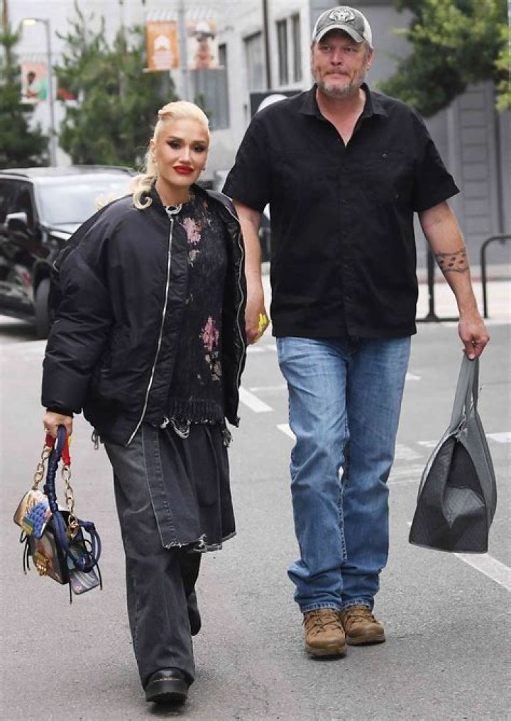 Gwen Stefani walking with two of her sons