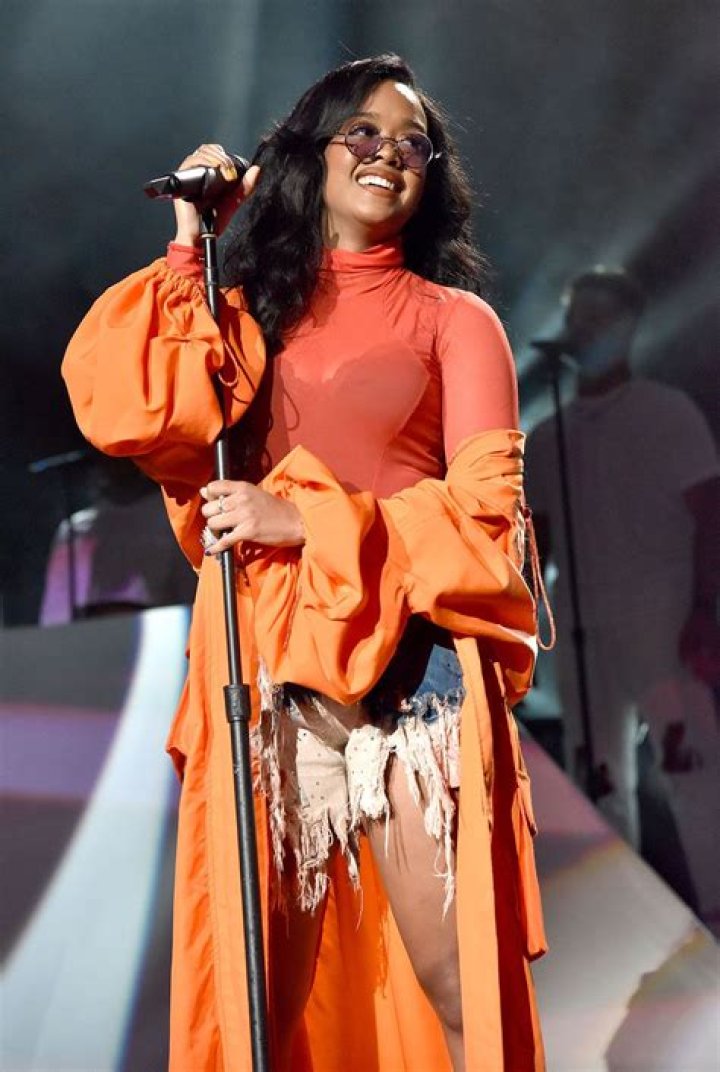 H.E.R. performing on stage