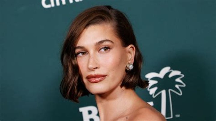 Hailey Bieber Is Fierce In A White Crop Top & Cargo Pants Stepping Out In NYC